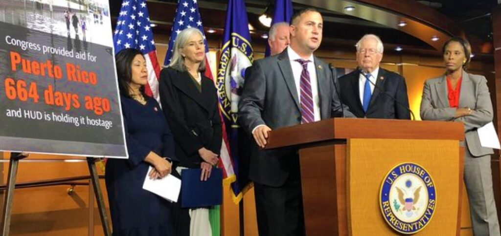 Photo via Congressman Darren Soto's (center, at podium) website.