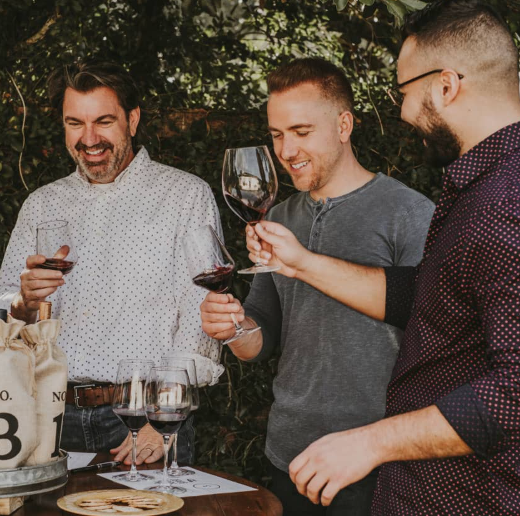 The Good Pour co-founder and Sales head Ray Horal (center) enjoys red wine with The Good Pour Executive Creative Director Ron Boucher (left) and another colleague. Photo: The Good Pour.