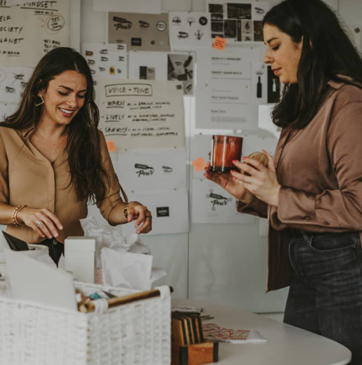 Giuliana Rossi (left), The Good Pour co-founder and head of Marketing, inspects some company product alongside Taylor Periu, The Good Pour's Franchise Coordinator.